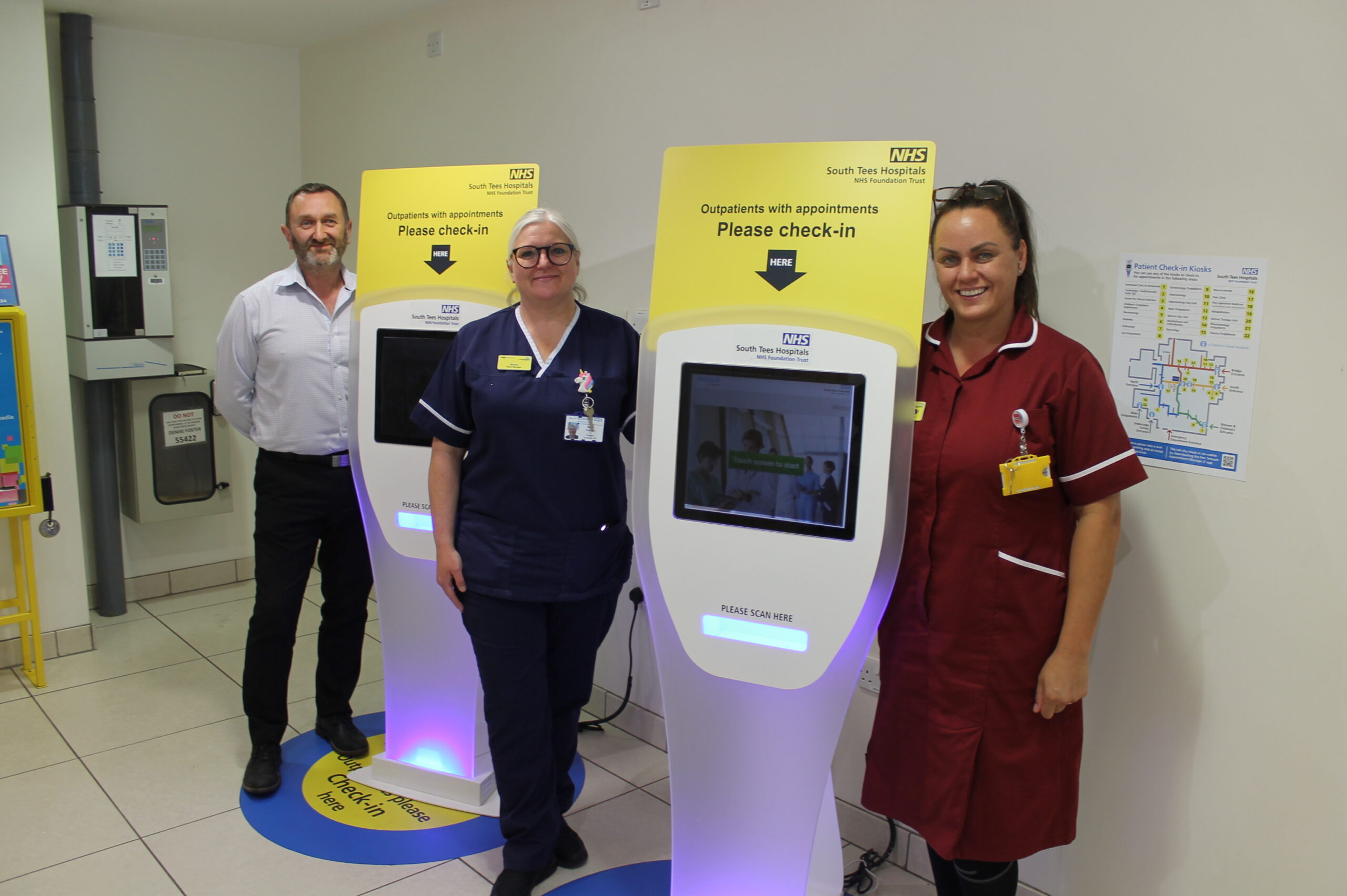 Left-to-right-Jay-Garrett-digital-programme-manager-Maxine-Stephens-ward-manager-and-HCA-Lindsey-Painter-with-the-self-check-in-kiosks-scaled